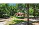 Charming single-story home with mature landscaping, circular drive, and inviting front entrance at 21795 Sw 88Th Lane Rd, Dunnellon, FL 34431