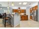 Modern kitchen with stainless steel appliances and a breakfast bar at 21795 Sw 88Th Lane Rd, Dunnellon, FL 34431