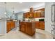 Charming kitchen features wood cabinetry, granite countertops, and central island at 21795 Sw 88Th Lane Rd, Dunnellon, FL 34431