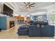 Open living room with a fireplace, tile flooring, and a view of the kitchen at 21795 Sw 88Th Lane Rd, Dunnellon, FL 34431