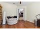 Bright living room with hardwood floors and a comfortable reading nook at 21795 Sw 88Th Lane Rd, Dunnellon, FL 34431