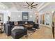 Open living room boasts a vaulted ceiling and French doors at 21795 Sw 88Th Lane Rd, Dunnellon, FL 34431