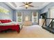 Large main bedroom with a ceiling fan, and access to a treadmill at 21795 Sw 88Th Lane Rd, Dunnellon, FL 34431