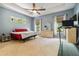 Airy main bedroom features a ceiling fan and lots of natural light at 21795 Sw 88Th Lane Rd, Dunnellon, FL 34431
