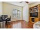 Charming office with wood floors, built in shelving and plantation shutters at 21795 Sw 88Th Lane Rd, Dunnellon, FL 34431
