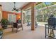 Outdoor patio with screened enclosure and ceiling fans at 21795 Sw 88Th Lane Rd, Dunnellon, FL 34431