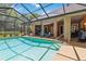 Sparkling pool with screened enclosure at 21795 Sw 88Th Lane Rd, Dunnellon, FL 34431