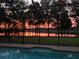 Enjoy tranquil water views and stunning sunsets from this screened-in pool at 21795 Sw 88Th Lane Rd, Dunnellon, FL 34431