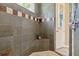 Custom tiled shower with integrated seat and corner shelf at 21795 Sw 88Th Lane Rd, Dunnellon, FL 34431