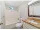 Bathroom with shower-tub combination and granite vanity at 220 Colony Pl, Casselberry, FL 32707