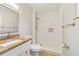 Bright bathroom with a granite vanity and a glass enclosed, tiled walk-in shower at 220 Colony Pl, Casselberry, FL 32707