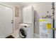 Cozy laundry room with modern appliances and ample storage space at 220 Colony Pl, Casselberry, FL 32707