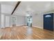 Bright living room with wood floors and dark blue front door at 220 Colony Pl, Casselberry, FL 32707