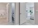 Hallway leading to a closet, bathroom, and bedroom with neutral color palette at 2249 Lake Preserve Cir, New Smyrna Beach, FL 32168