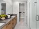 Elegant bathroom showcasing double vanities, granite countertops, and a walk-in shower at 2486 Celebration Blvd, Celebration, FL 34747