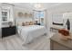 Serene main bedroom featuring a tray ceiling, plush bedding, and ample natural light at 2486 Celebration Blvd, Celebration, FL 34747