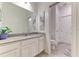 Bright bathroom featuring a vanity with granite countertop, modern fixtures, and tiled flooring at 2537 Shanti Dr, Kissimmee, FL 34746