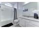 Bright bathroom featuring a shower and tub combination and a white single sink vanity with gray countertops at 2537 Shanti Dr, Kissimmee, FL 34746
