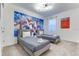 Fun bedroom featuring two beds with an avengers poster and soft carpet flooring with natural light at 2537 Shanti Dr, Kissimmee, FL 34746