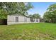 Exterior home shot showing the side view of a grassy backyard at 2753 Beckwith St, Deltona, FL 32738