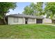 Charming single-story home with a well-maintained lawn and attached garage at 2753 Beckwith St, Deltona, FL 32738