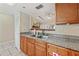 Kitchen featuring wood cabinets and an open view to the living area at 2753 Beckwith St, Deltona, FL 32738