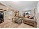 Comfortable living room with plush sofa, stylish decor, and tile flooring at 2753 Beckwith St, Deltona, FL 32738