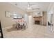 Open-concept living area with a brick fireplace and tile floors at 2753 Beckwith St, Deltona, FL 32738
