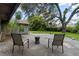 This backyard has plenty of seating, grass, and a basketball court at 3220 Cardigan Ct, Orlando, FL 32812