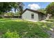 This backyard is equipped with a patio, basketball court, and green grass at 3220 Cardigan Ct, Orlando, FL 32812