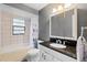 This bathroom has tile floors, shower, and a spacious vanity at 3220 Cardigan Ct, Orlando, FL 32812