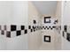 This bathroom features black and white checkerboard tile in the shower and accent pieces at 3220 Cardigan Ct, Orlando, FL 32812