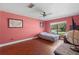 Bright bedroom featuring a ceiling fan and a large window overlooking the front yard at 3220 Cardigan Ct, Orlando, FL 32812