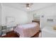 This bedroom has sleek floors, makeup vanity, and plenty of natural light at 3220 Cardigan Ct, Orlando, FL 32812