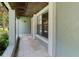 Welcoming front porch with tiled flooring, an outside view, and neutral paint at 3220 Cardigan Ct, Orlando, FL 32812