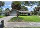 Charming home with a well-manicured lawn, mature landscaping, and a two-car garage at 3220 Cardigan Ct, Orlando, FL 32812