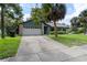 Charming home with a well-manicured lawn, mature landscaping, and a two-car garage at 3220 Cardigan Ct, Orlando, FL 32812