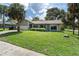 Charming home with a well-manicured lawn, mature landscaping, and a two-car garage at 3220 Cardigan Ct, Orlando, FL 32812