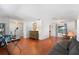 Open-concept living space with beautiful wood floors and neutral wall colors at 3220 Cardigan Ct, Orlando, FL 32812
