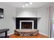 Living room features a decorative fireplace with a dark hearth and mantle at 3220 Cardigan Ct, Orlando, FL 32812