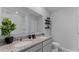 Well-lit bathroom has double sinks, granite countertops and decorative shelving at 3304 Wye Oak Dr, Apopka, FL 32703