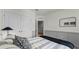 Bedroom showcasing paneled walls, a spacious closet, and contemporary decor at 3304 Wye Oak Dr, Apopka, FL 32703