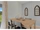 Stylish dining area with modern decor, table setting, and natural light at 3304 Wye Oak Dr, Apopka, FL 32703