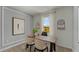 Home office featuring a bright window, sleek furniture, and modern wall decor at 3304 Wye Oak Dr, Apopka, FL 32703