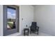 Inviting front porch with a stylish chair and small table, creating a welcoming entryway at 3304 Wye Oak Dr, Apopka, FL 32703
