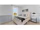 Comfortable bedroom with natural light, stylish wainscoting, and a cozy bed for relaxation at 3310 Wye Oak Dr, Apopka, FL 32703