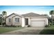 Charming single-story home featuring a two-car garage, landscaped yard, and a neutral color palette at 336 Free Range Dr, Clermont, FL 34715