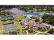 Aerial view of a community with a lake, pool, tennis courts, and clubhouse at 387 Devon Pl, Lake Mary, FL 32746