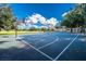 Outdoor basketball court featuring a well-maintained playing surface, hoops, and backboards with a clear blue sky backdrop at 387 Devon Pl, Lake Mary, FL 32746