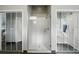 Bathroom with glass enclosed shower and view into the bathroom with soaking tub at 387 Devon Pl, Lake Mary, FL 32746